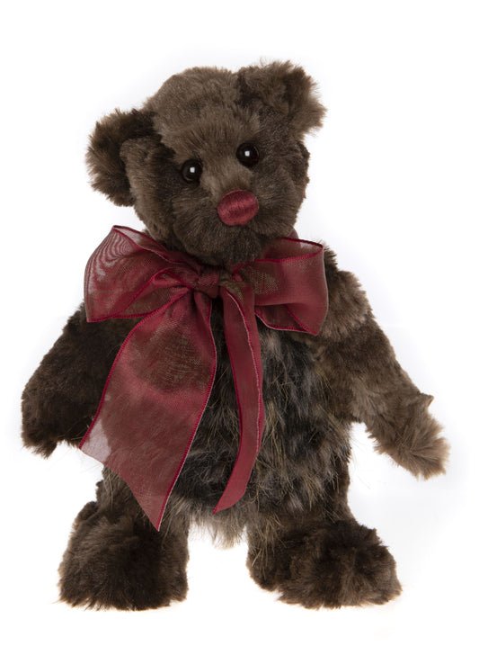 Small brown Charlie Bear with red nose and ribbon bow around neck