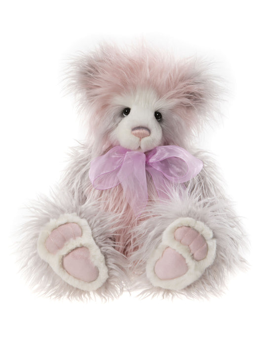 Pink and white plush Charlie Bear with large pink bow and long fur.