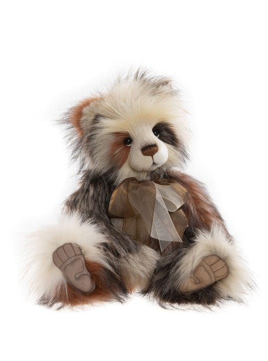 Brown and white plush Charlie Bear panda with cream and brown bow.