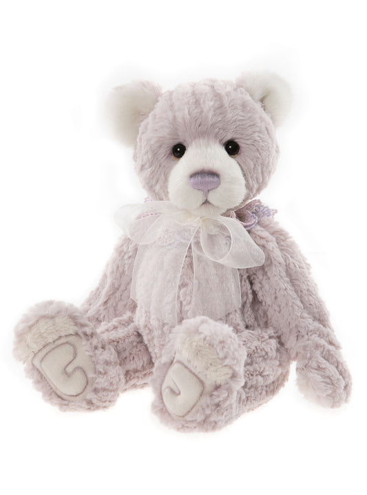 2022 Coorie bear with oft pink fur and a white bow