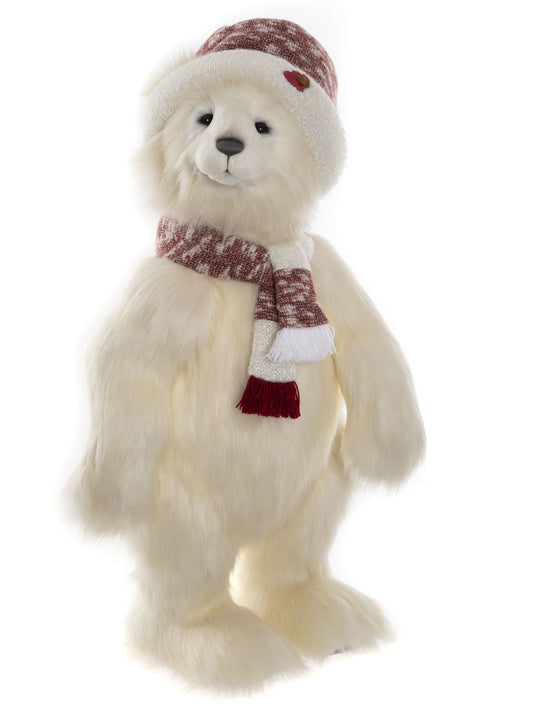 Standing white Charlie Bear polar bear with red and white hat and scarf